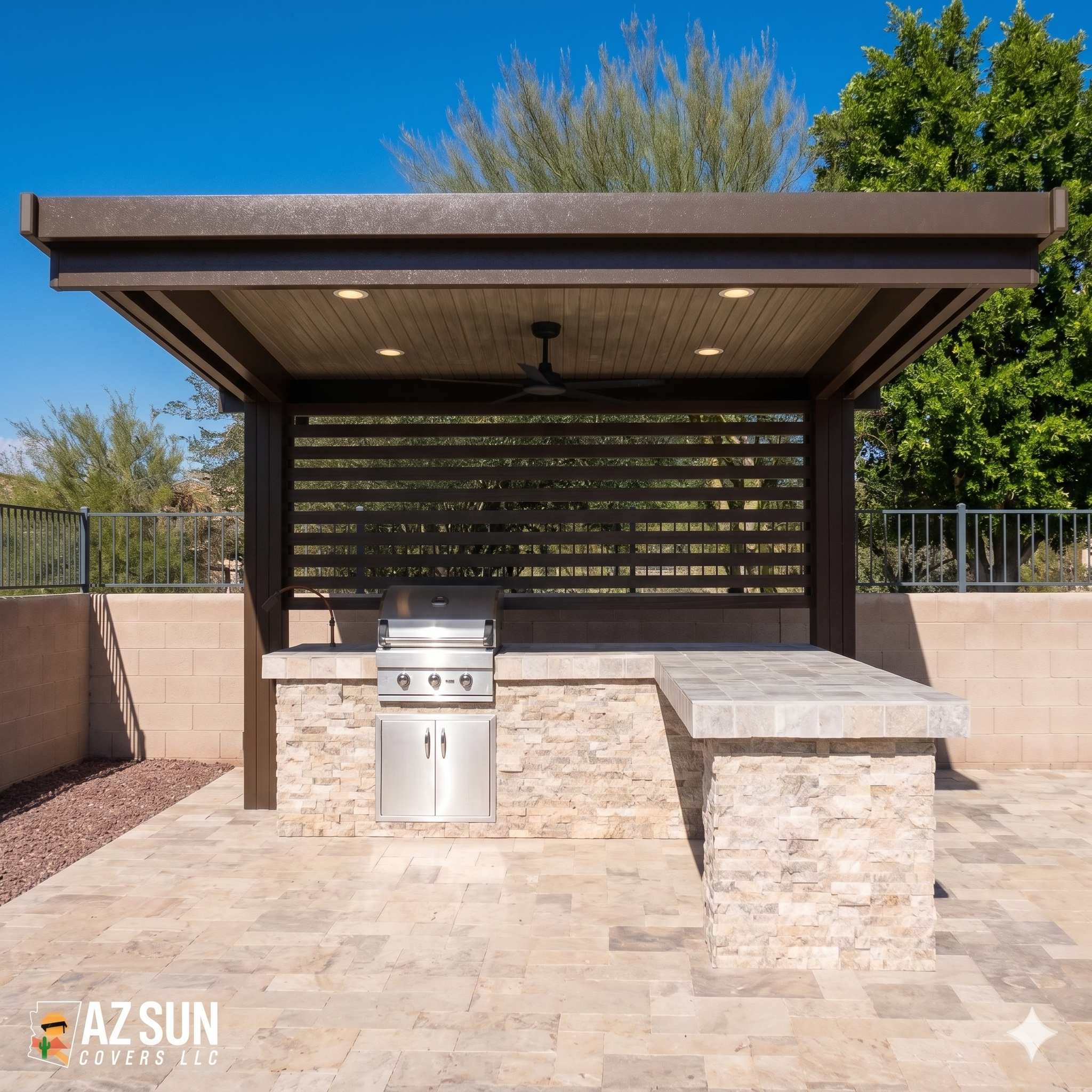 Bronze solid cover with privacy screen over outdoor kitchen