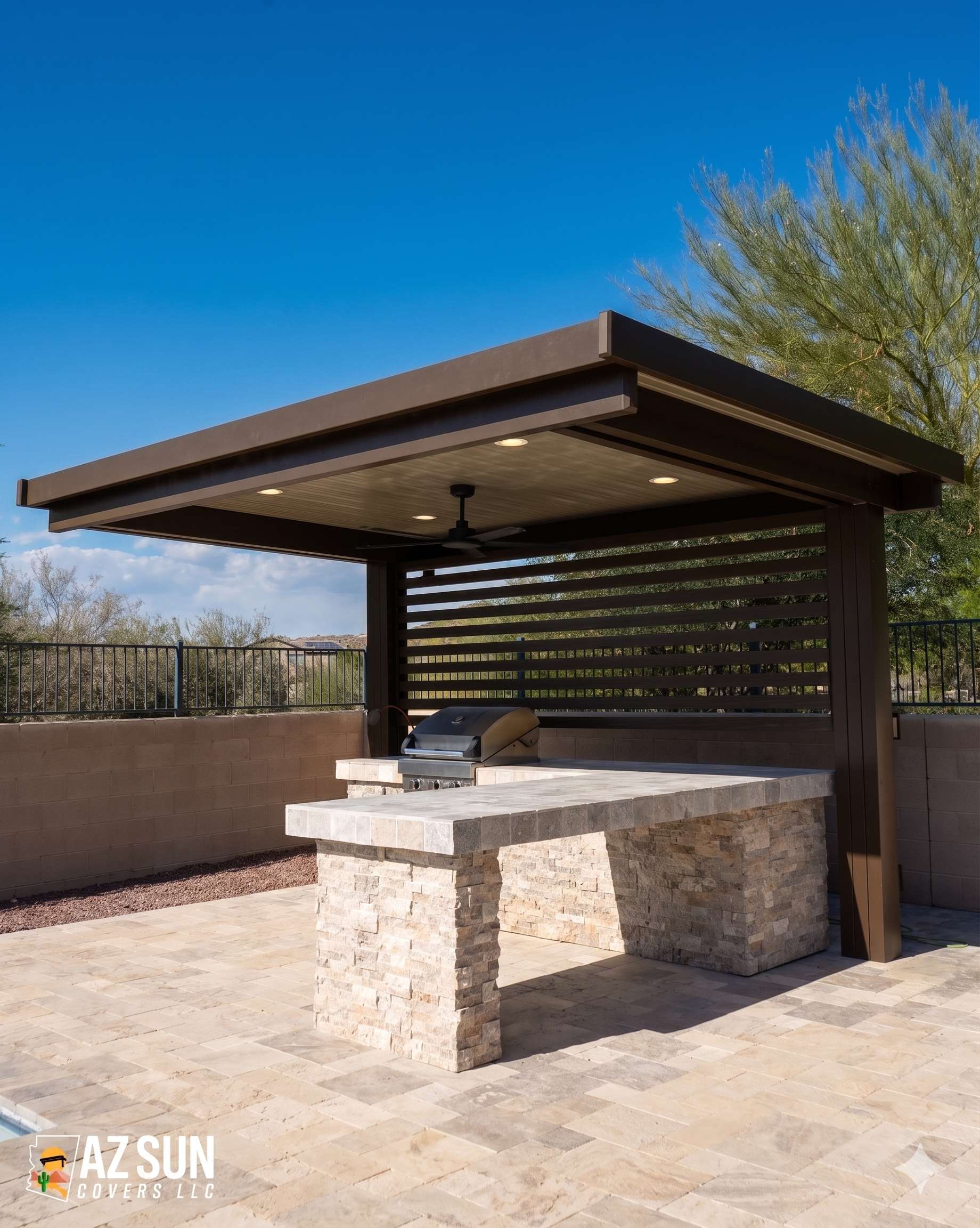 Bronze solid cover with ceiling fan over stone kitchen island