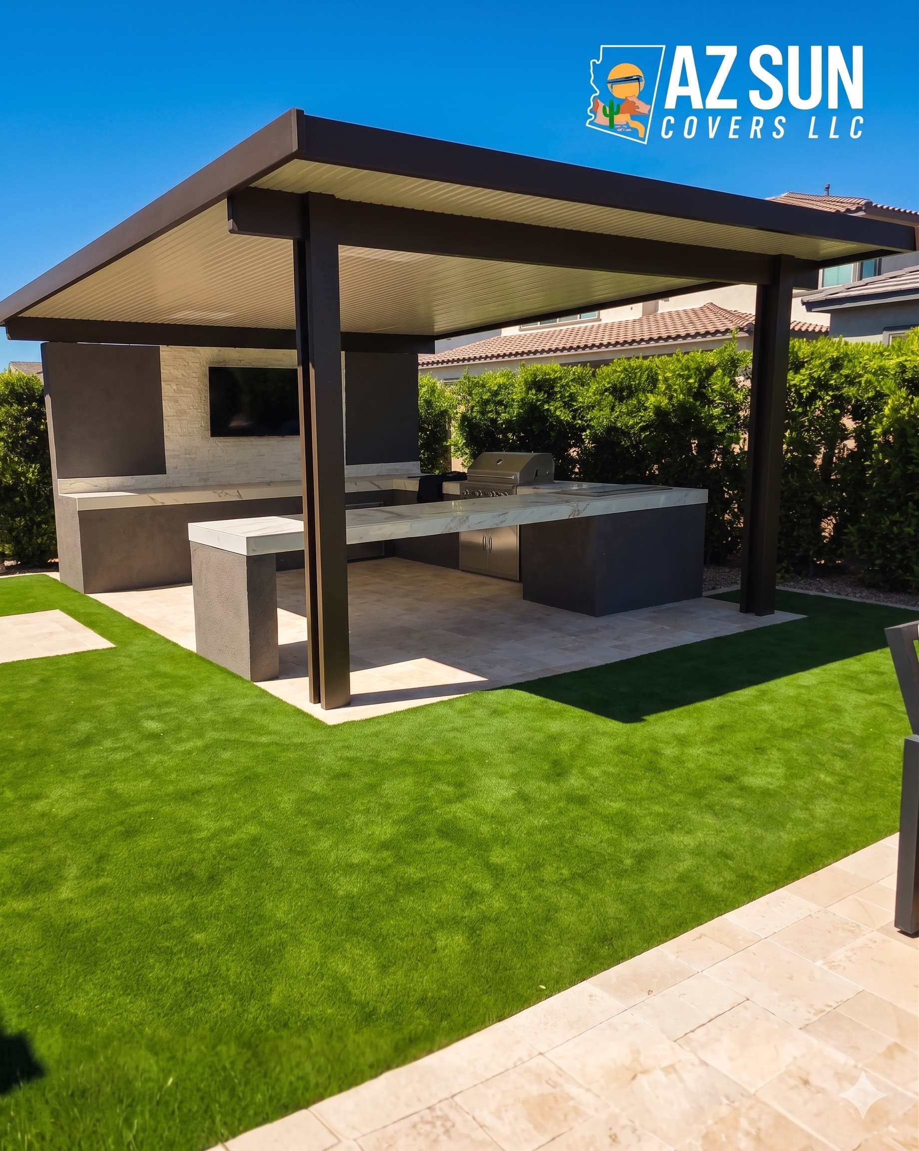 Dark solid cover over modern outdoor kitchen with TV