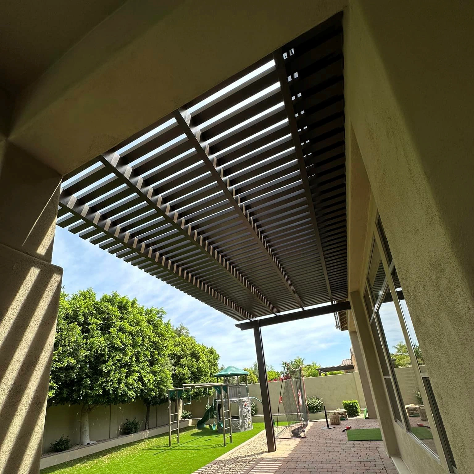 Brown lattice sun cover viewed from underneath